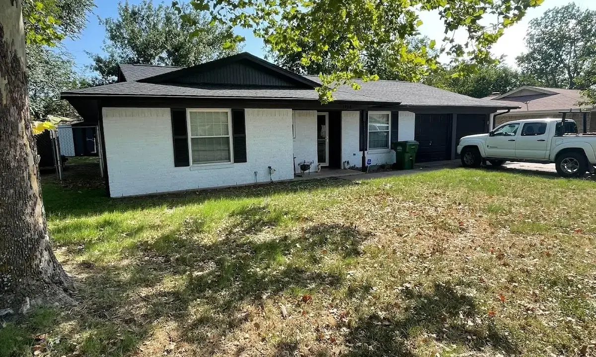 Professional roofing crew working on a residential roof in Bemidji